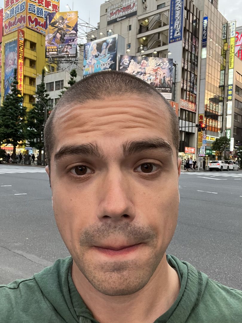 Joseph taking selfie on street in Tokyo