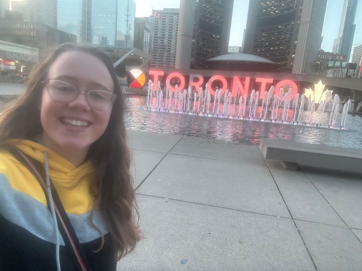 Elena taking selfie in front of Toronto fountain
