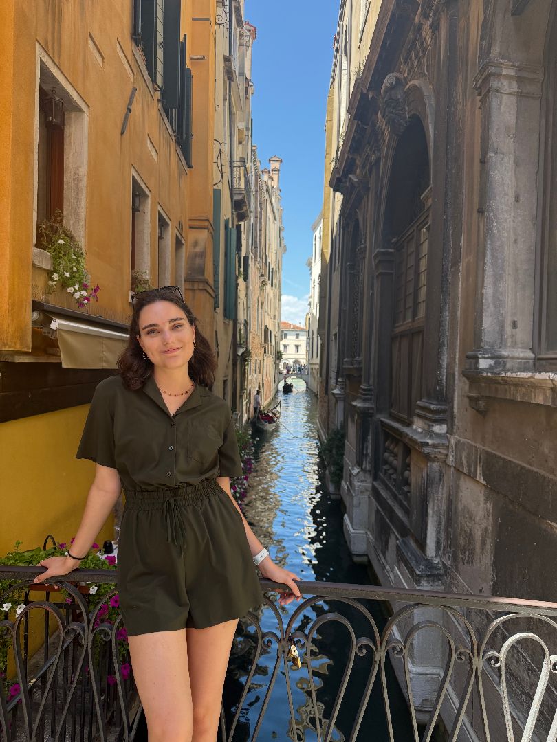 Abigail standing on a bridge above a canal in Venice