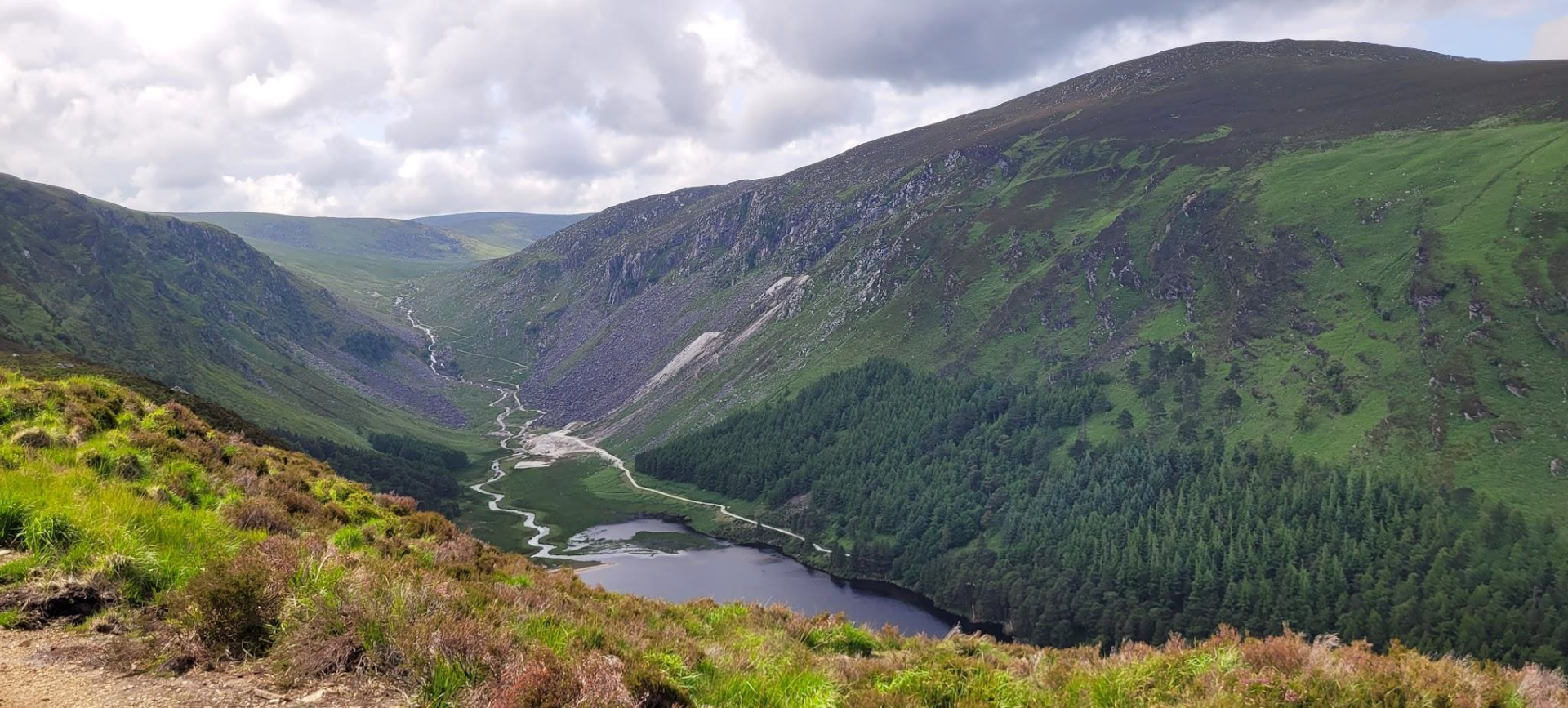 Lush green mountains with a river valley