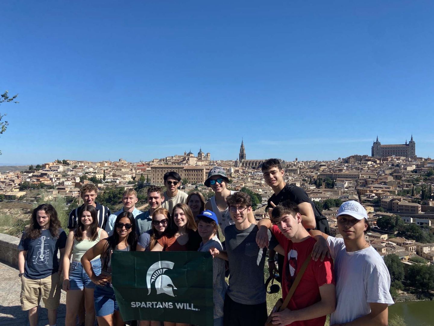 Group of students holding a Spartan flag in Spain