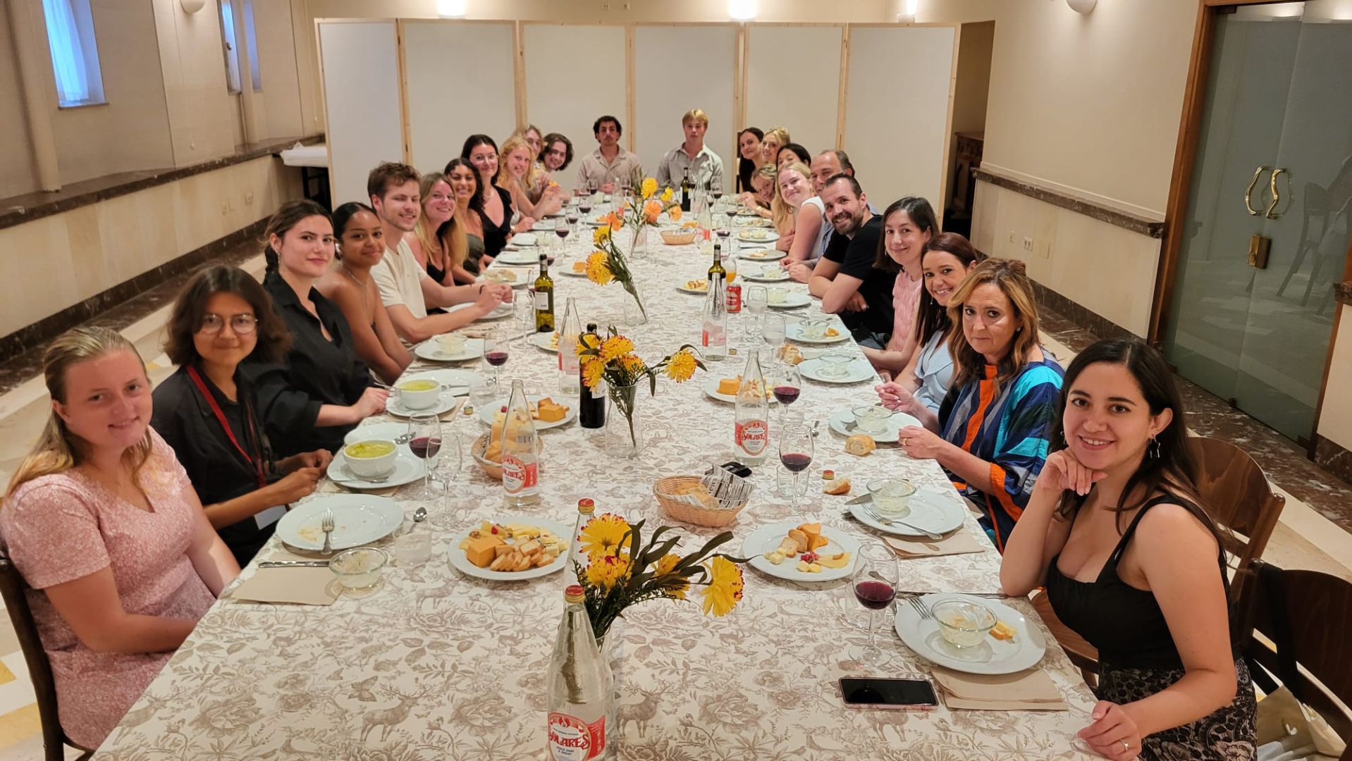 Students on Santander program at a group dinner
