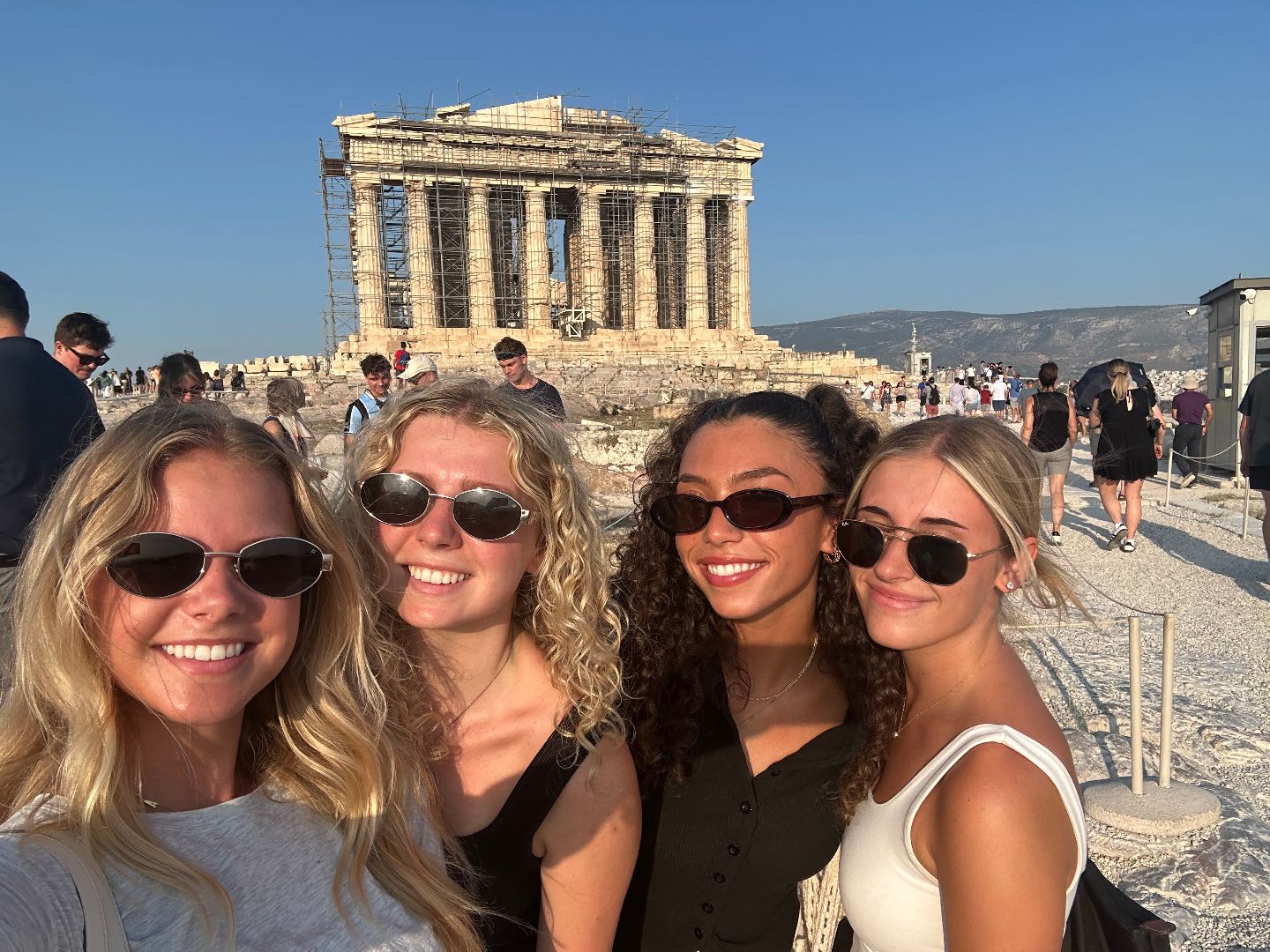 Allison and friends pose in front of the acropolis in Greece