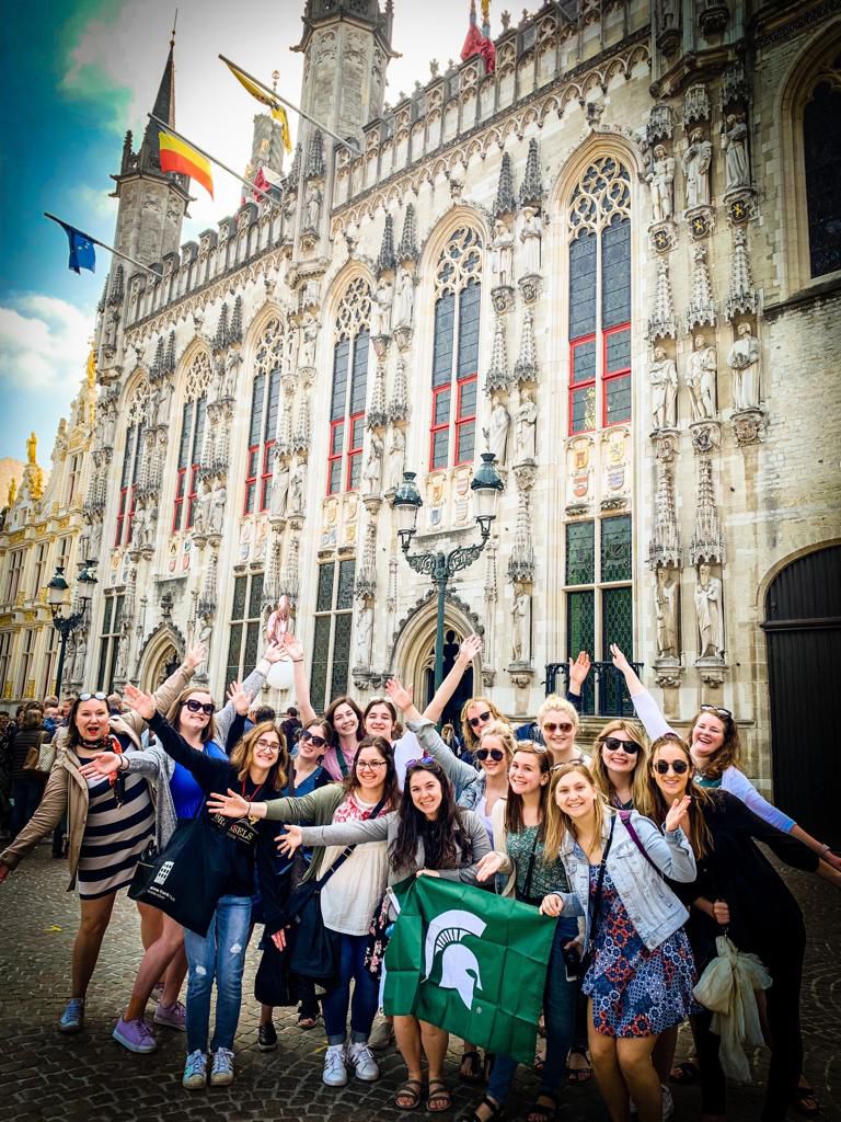 Group of students holding Spartan flag in Belgium