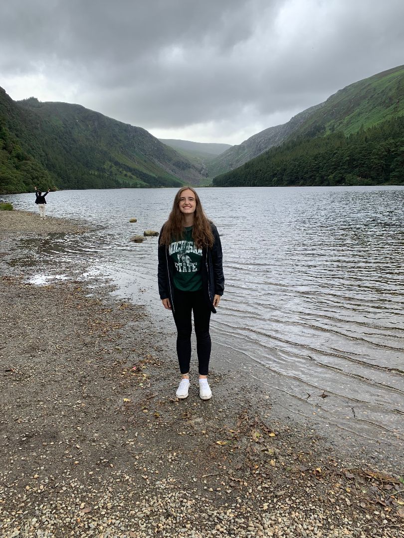Valerie standing by lake in Ireland
