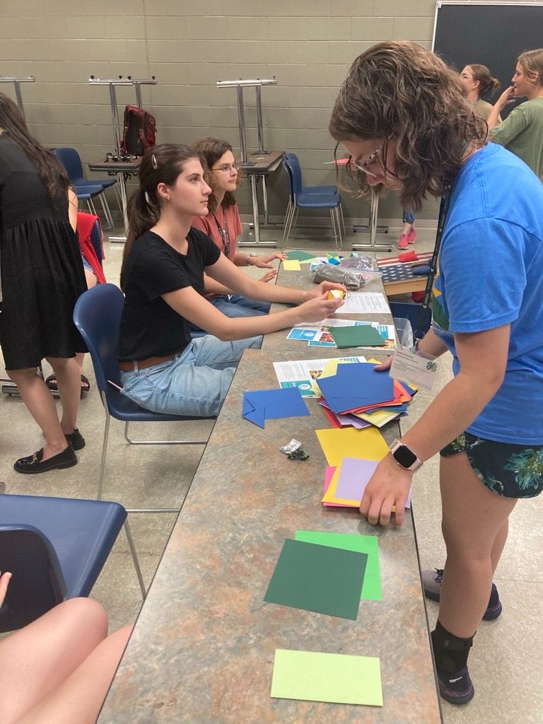 students folding sachets