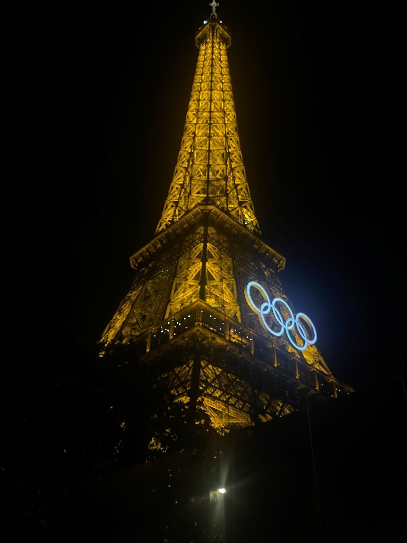 Eiffel Tower at night with the Olympic logo lit up