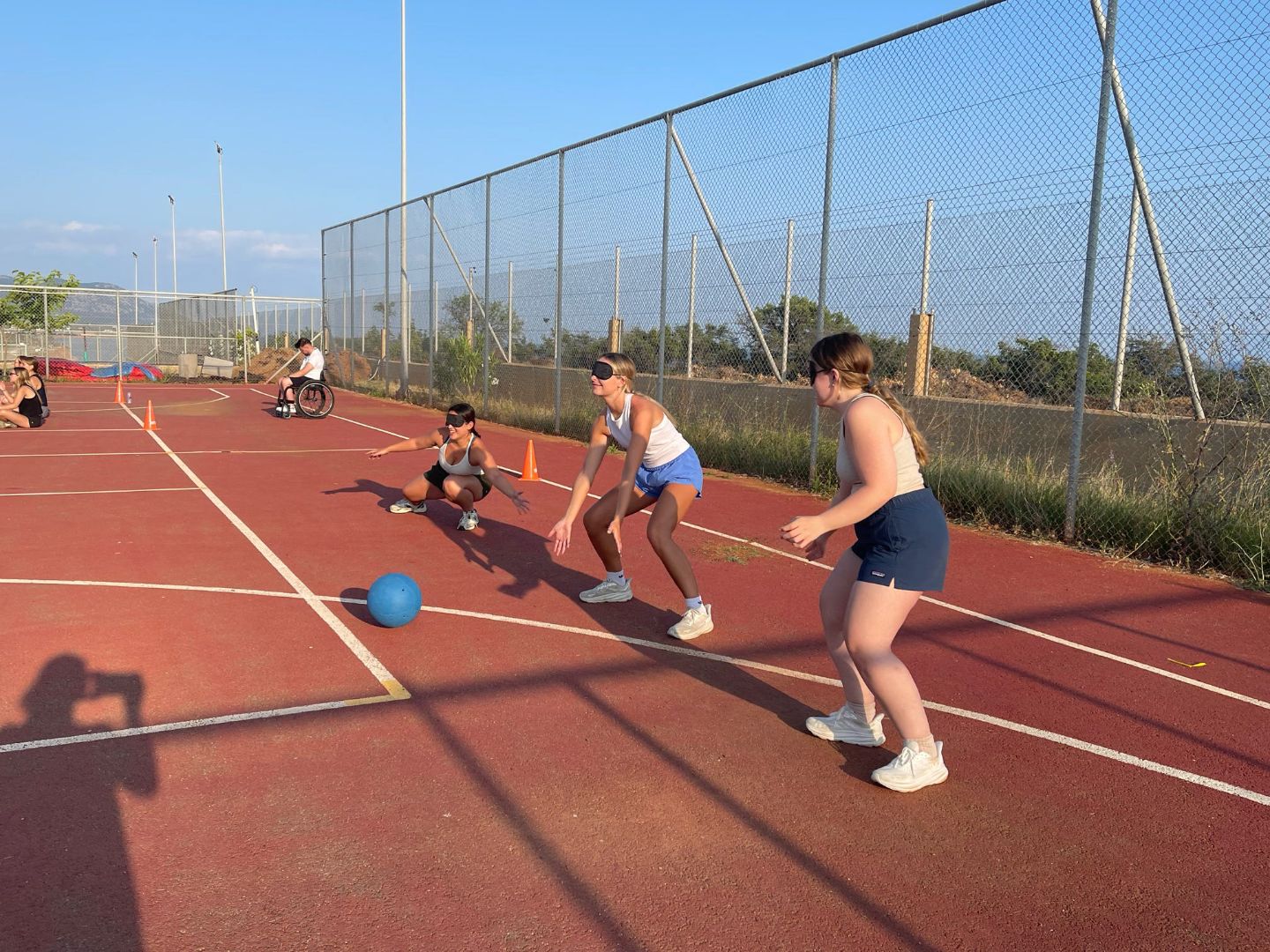 Gracie and classmates play ball game intended for blind people