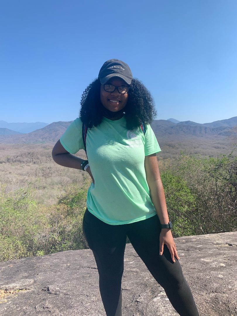 Toriona standing in front of mountains in Mexico