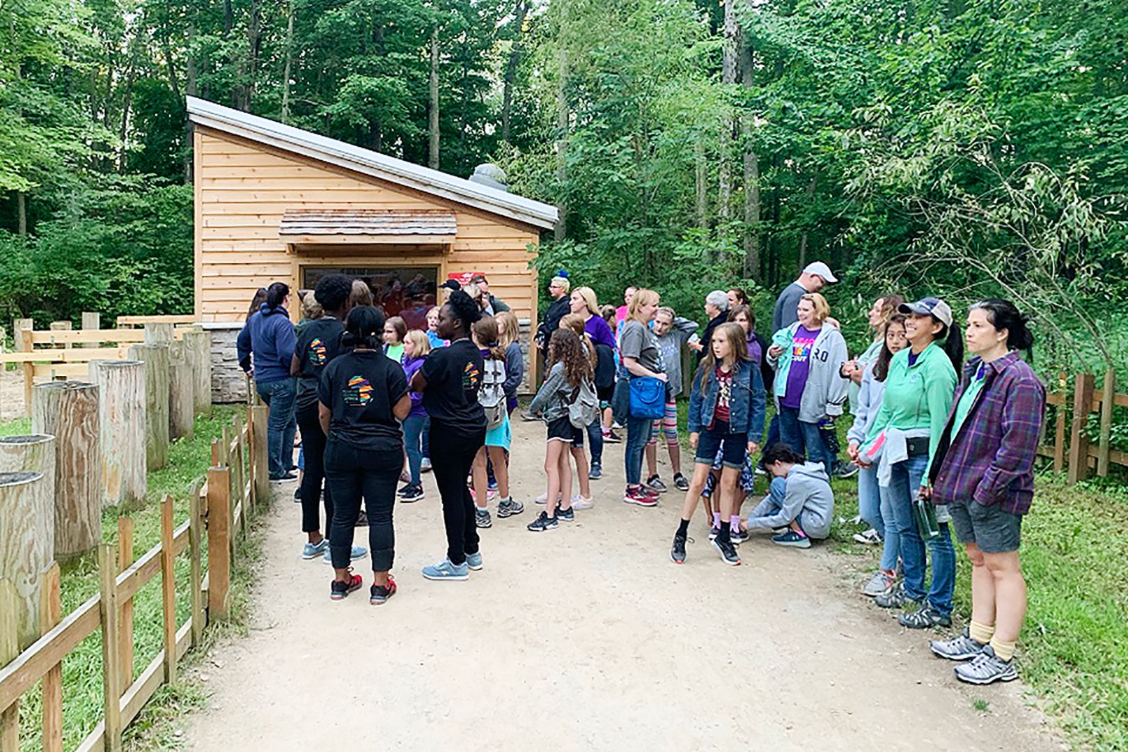 Group of people standing outside at zoo