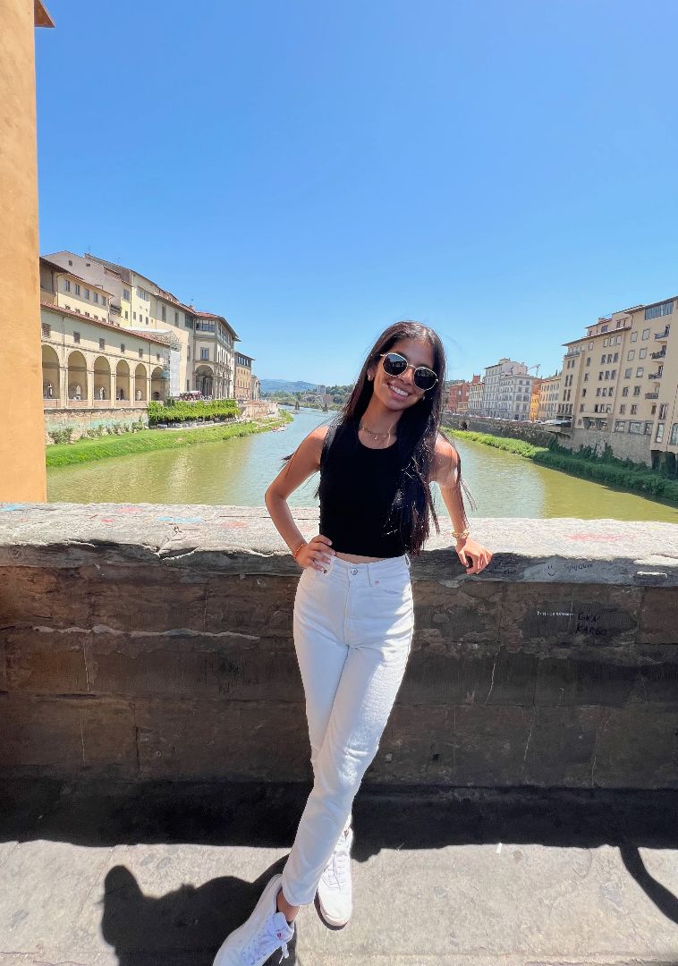 Riya standing on bridge in Florence