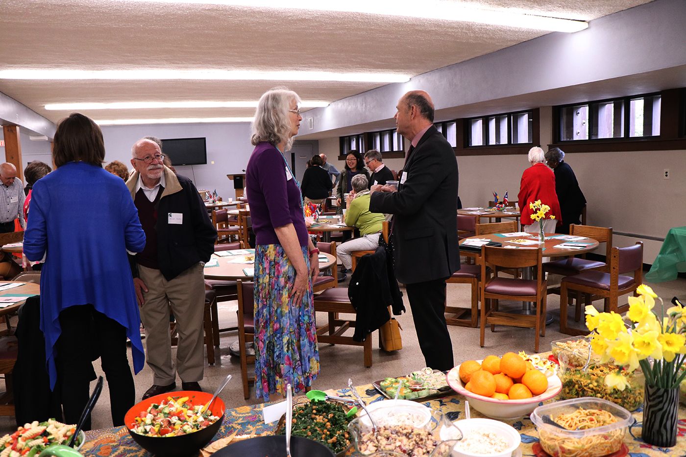 Crowd of people mingling before CVIP luncheon begins.