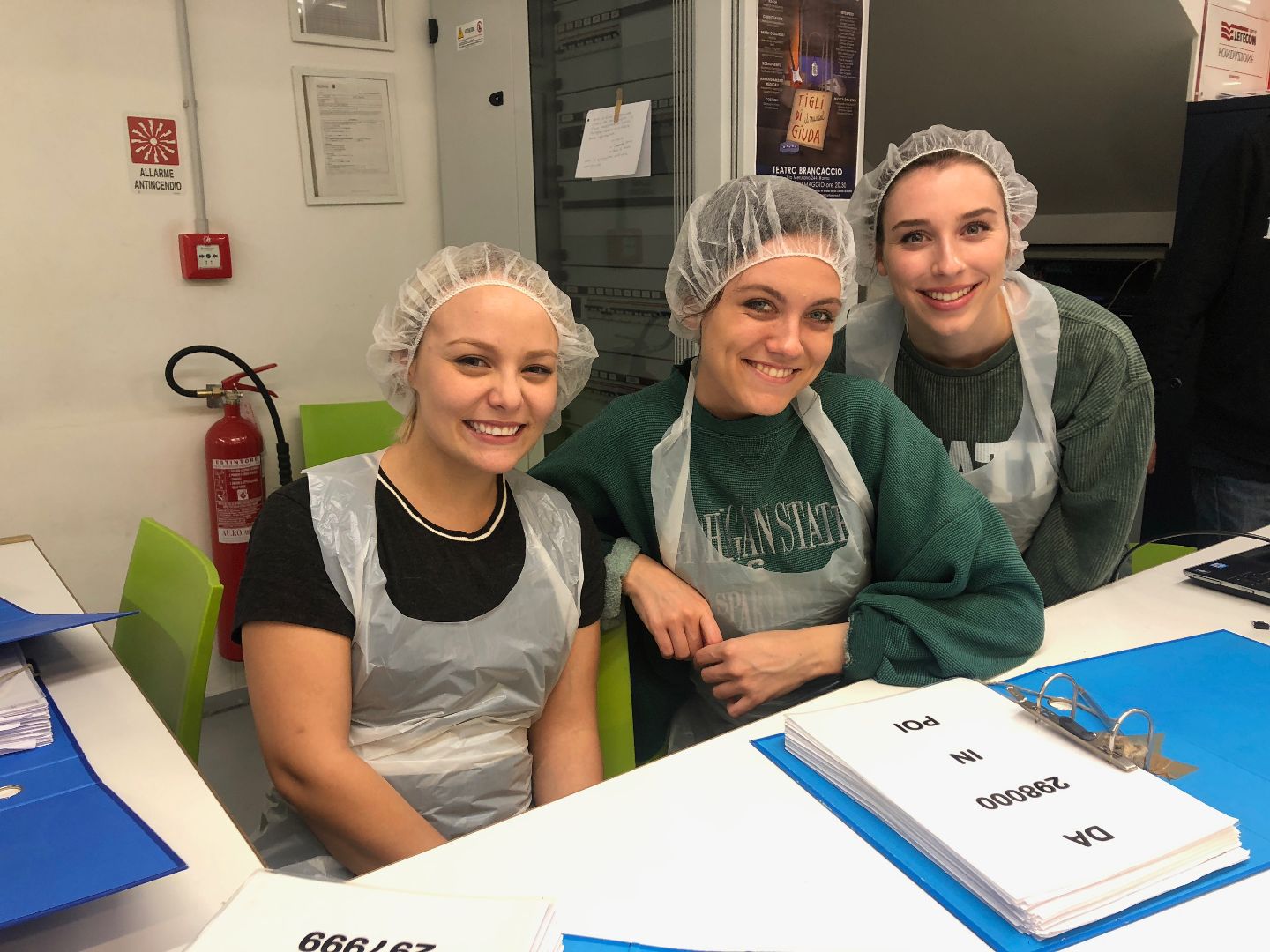 Group of students volunteering at homeless shelter in Italy