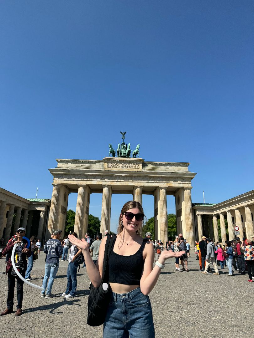 Sarah standing in front of the Brandenburg Gate in Germany