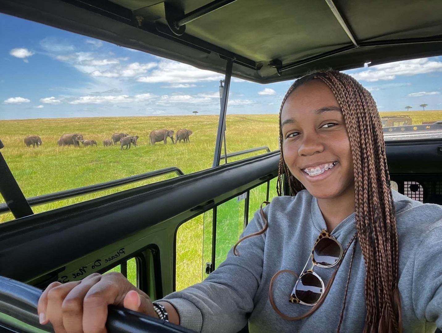 Lily in jeep during safari in Kenya