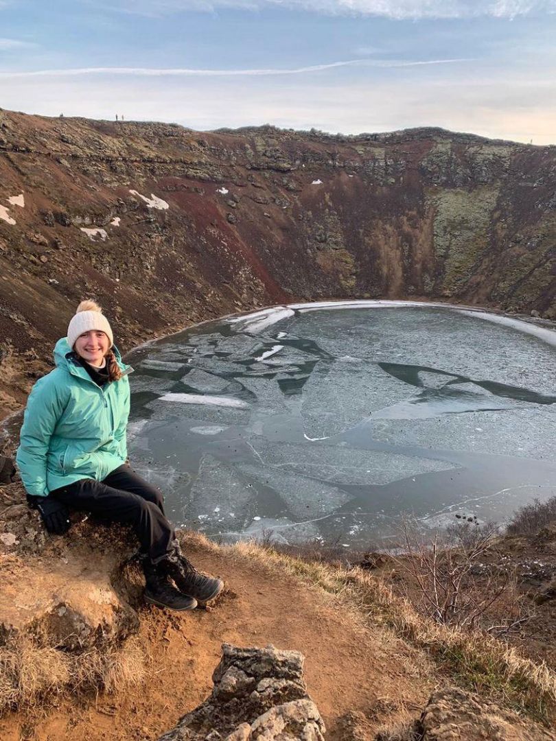 Emma sitting near crater in Iceland