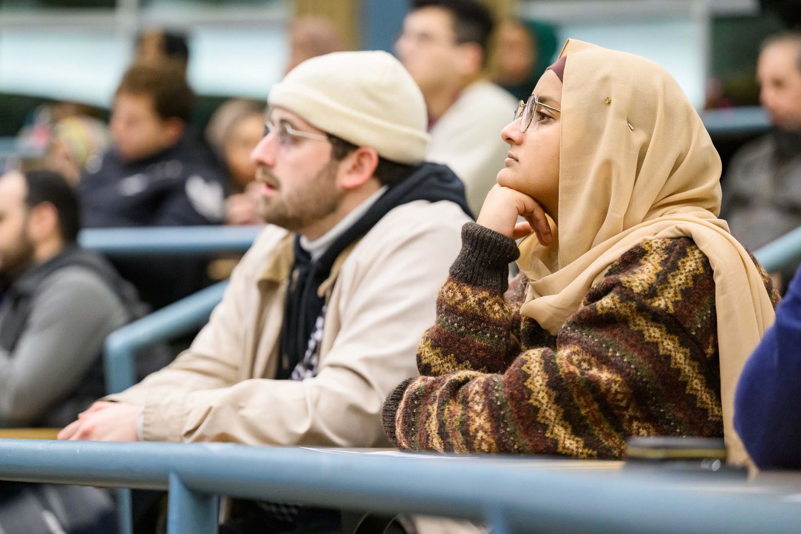 attendees sitting in a lecture hall