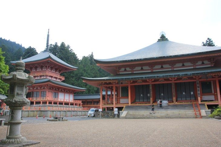 two bright red temples on a cloudy day