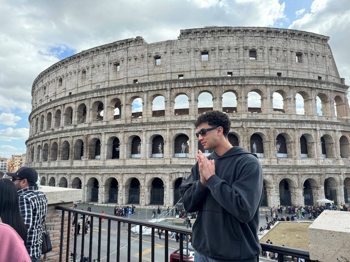 Julius standing in front ot the Colesium in Rome