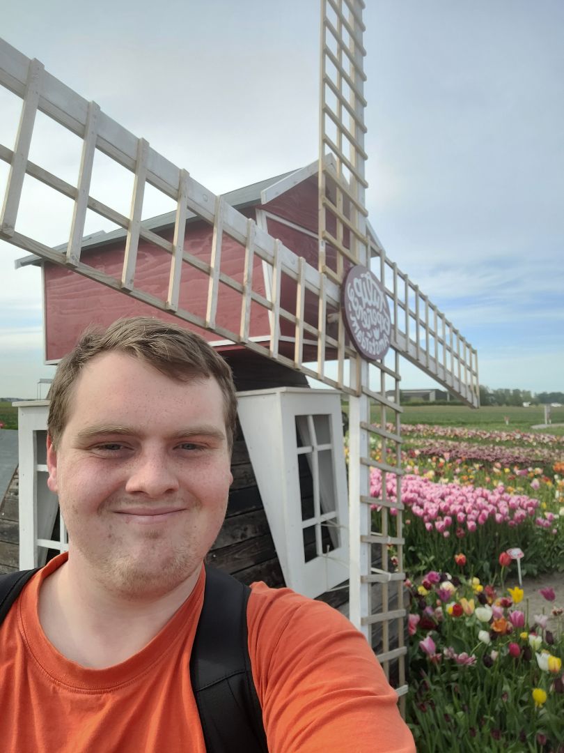 David standing in front of a Windmill