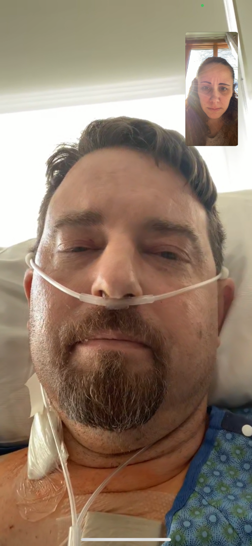 screenshot of man in hospital FaceTiming wife