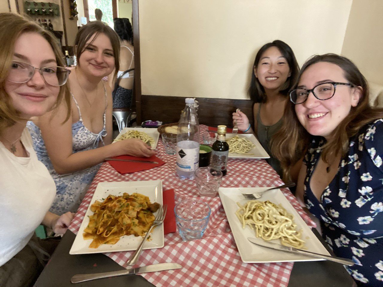 Ren and other MSU students eating pasta in Italy