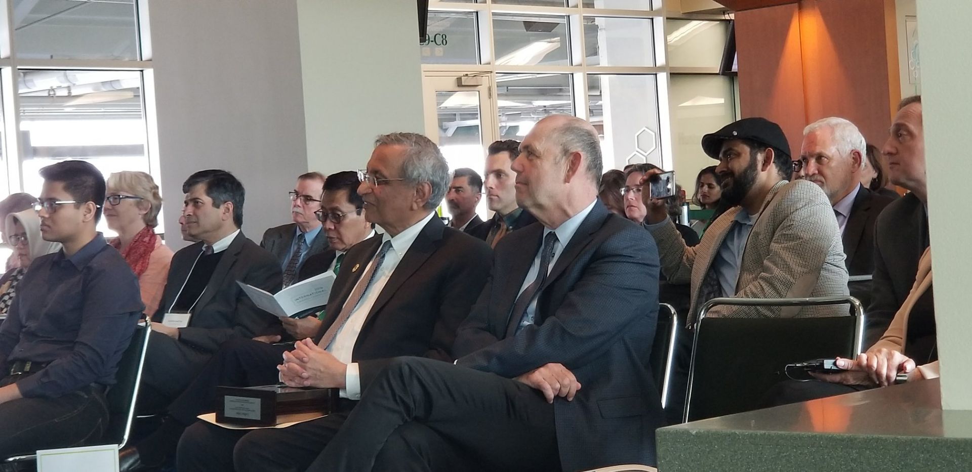 Some members of the audience listening to the students present. Pictured sitting in the audience: Dean Hanson and Satish Udpa, Acting President, MSU