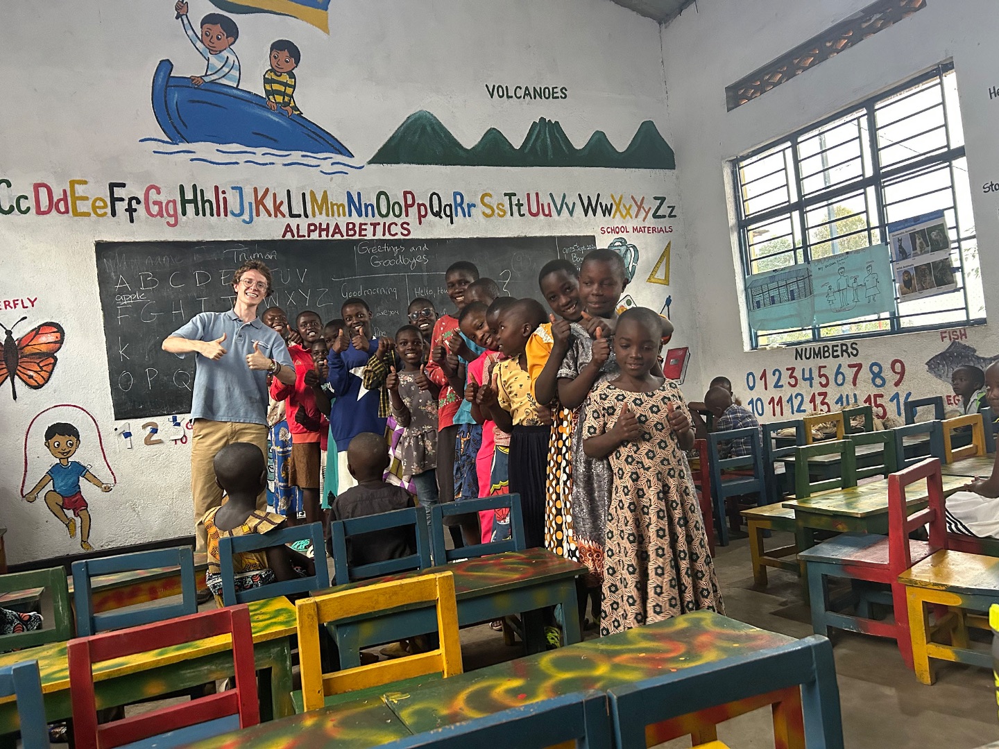 Truman Forbes teaches English to primary school students in Rwanda