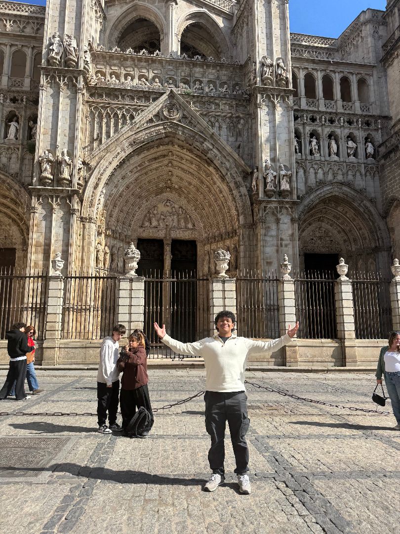 Mario standing with his arms wide in front of the Alhambra in Spain