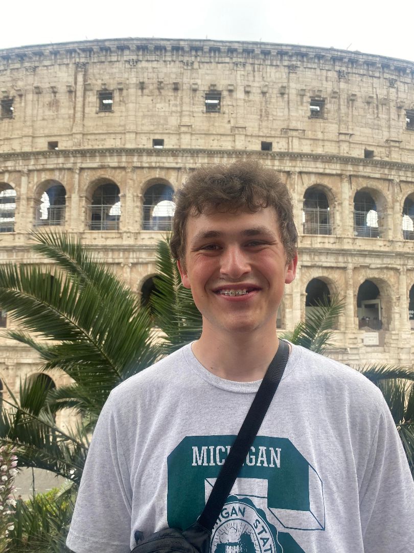 Jake standing in from on the Colesium in Rome, Italy