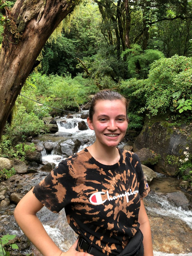 Sam standing near a stream in Costa Rica