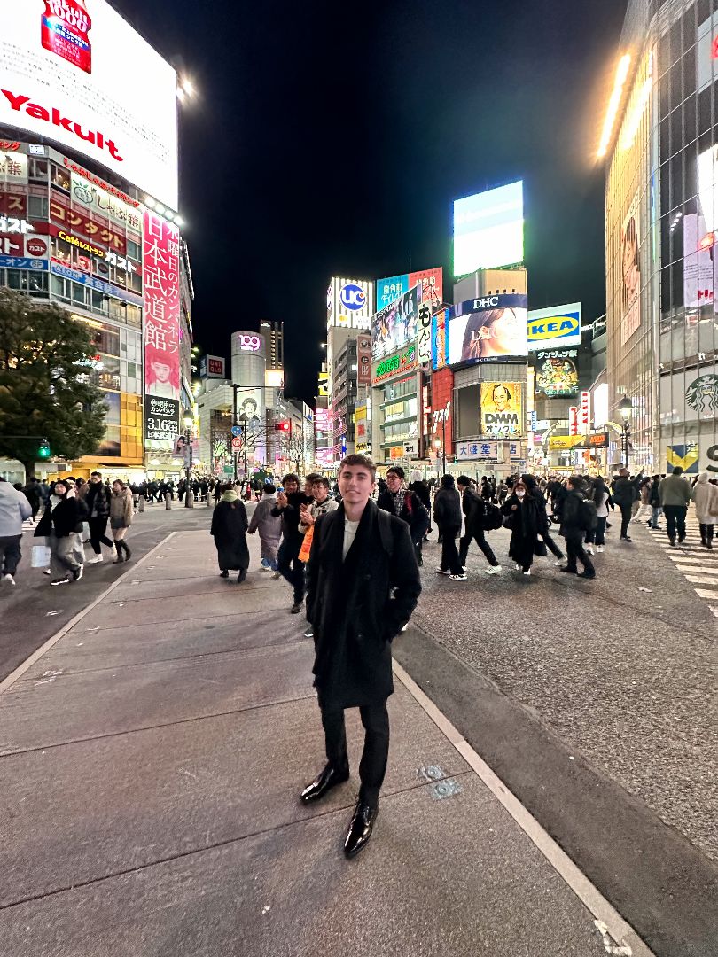 Max standing in the streets of Tokyo at night