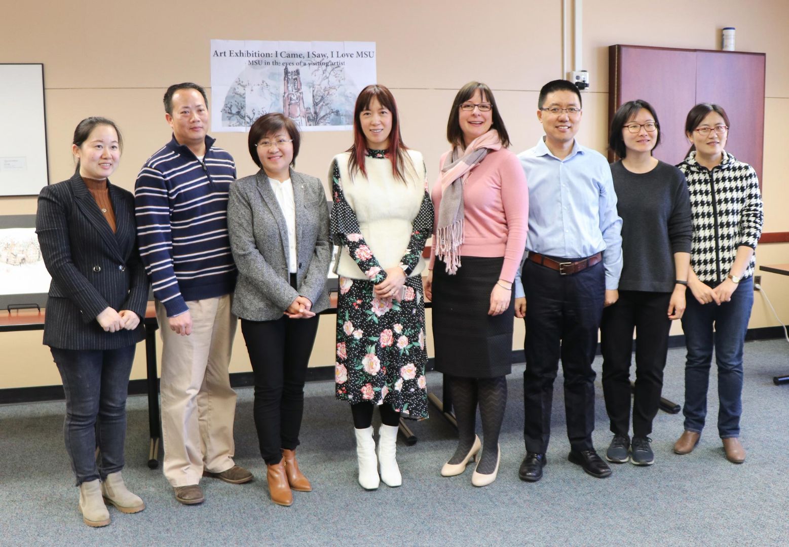 Rui Li stands with VIPP staff.
