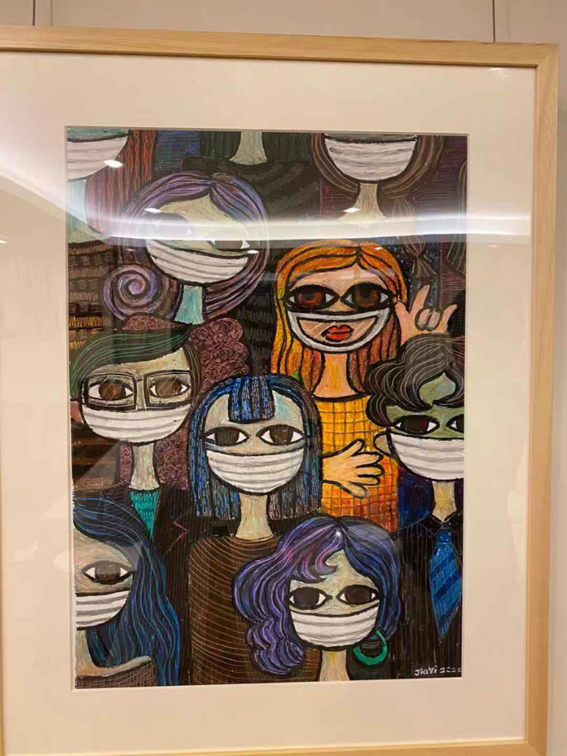 A close up image of one of Heller's paintings from his collection showing abstractly painted people in bright colors wearing masks. One signs I Love You in American Sign Language.