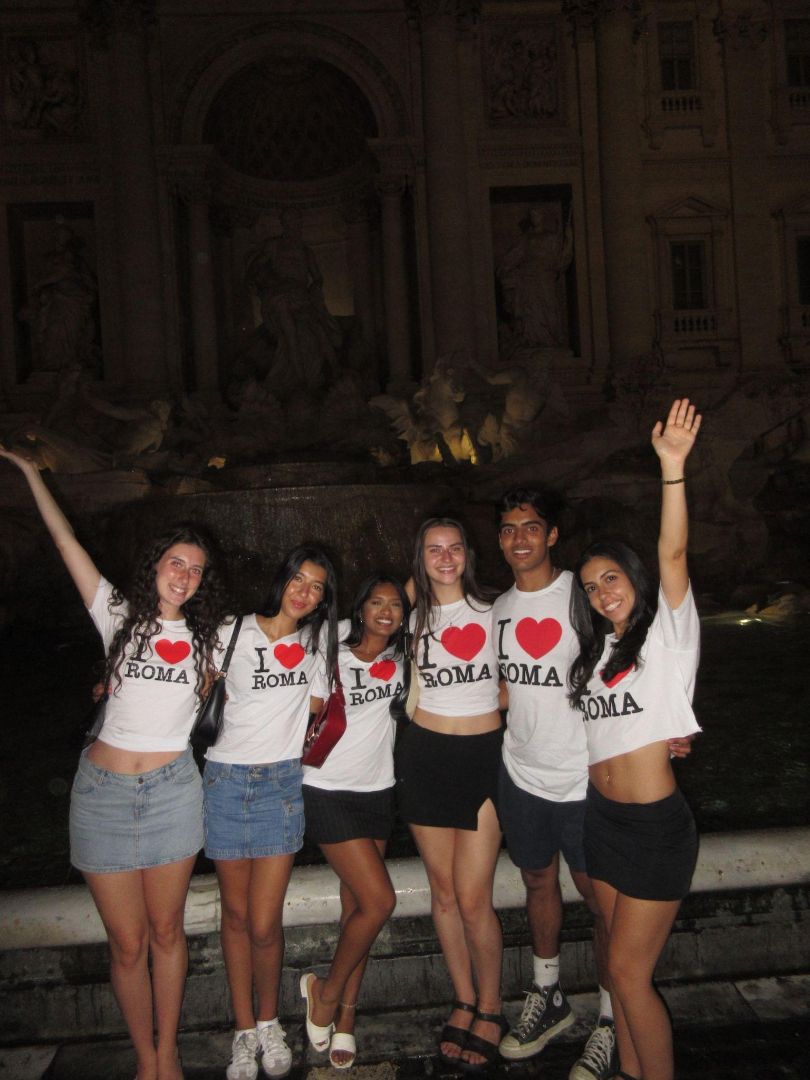 Nicole with other students wearing I love Roma shirts in front of the Trevi Fountain