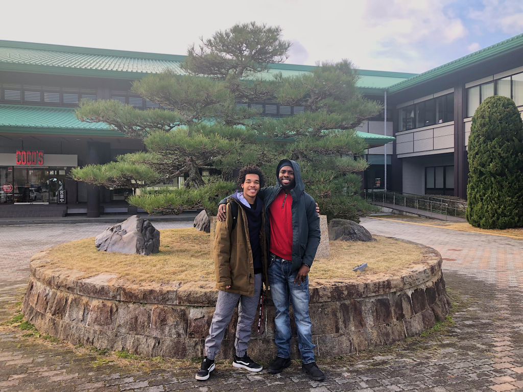 Two students smiling towards the camera