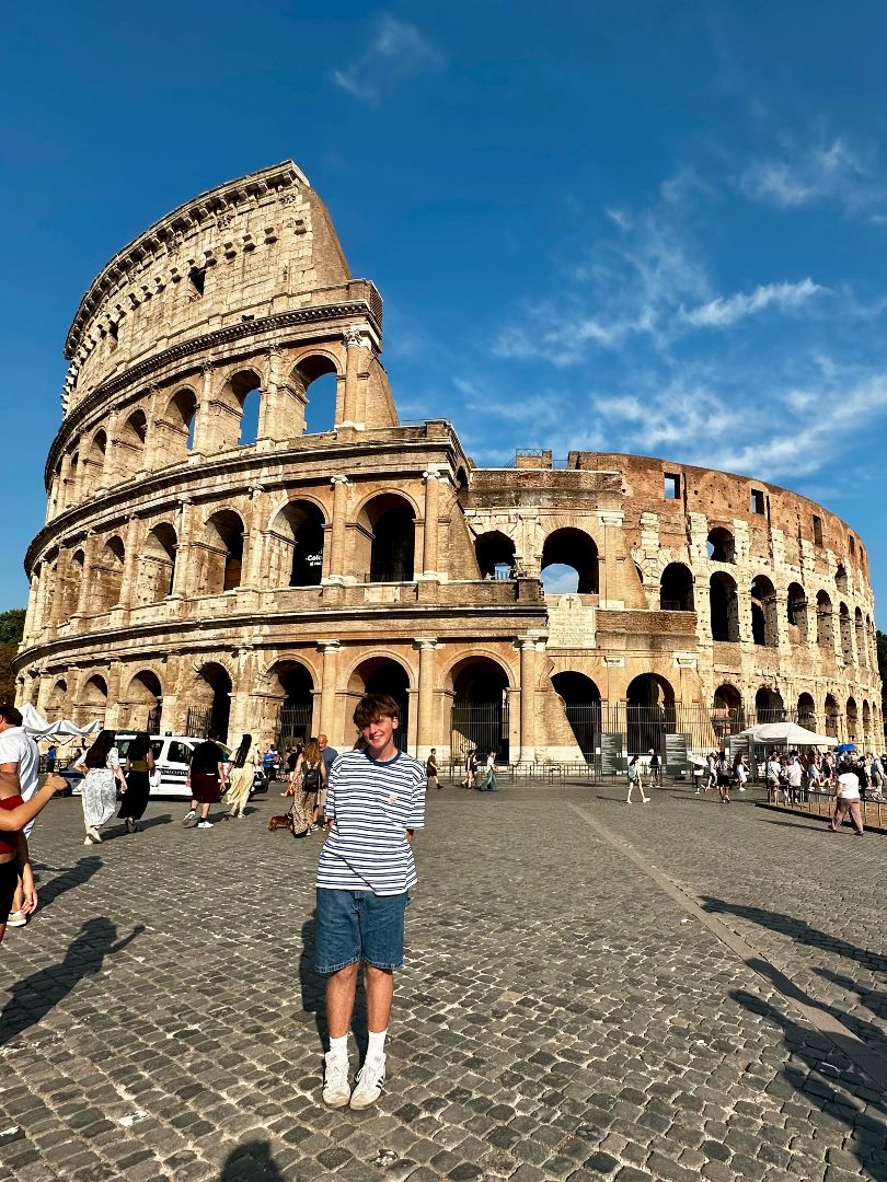 Josh standing in front of the Roman Colesium