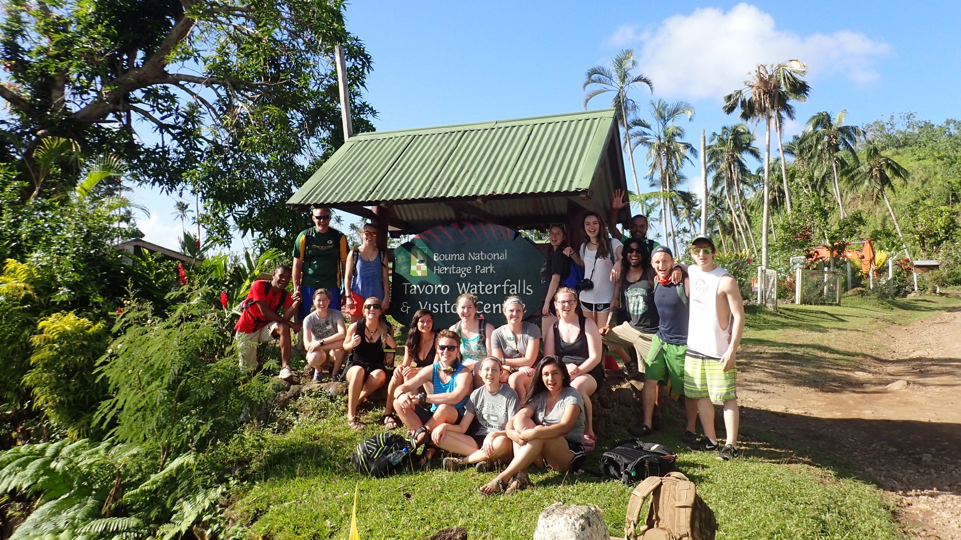 Tracy Melvin with a group of study abroad students, outdoors in Fiji