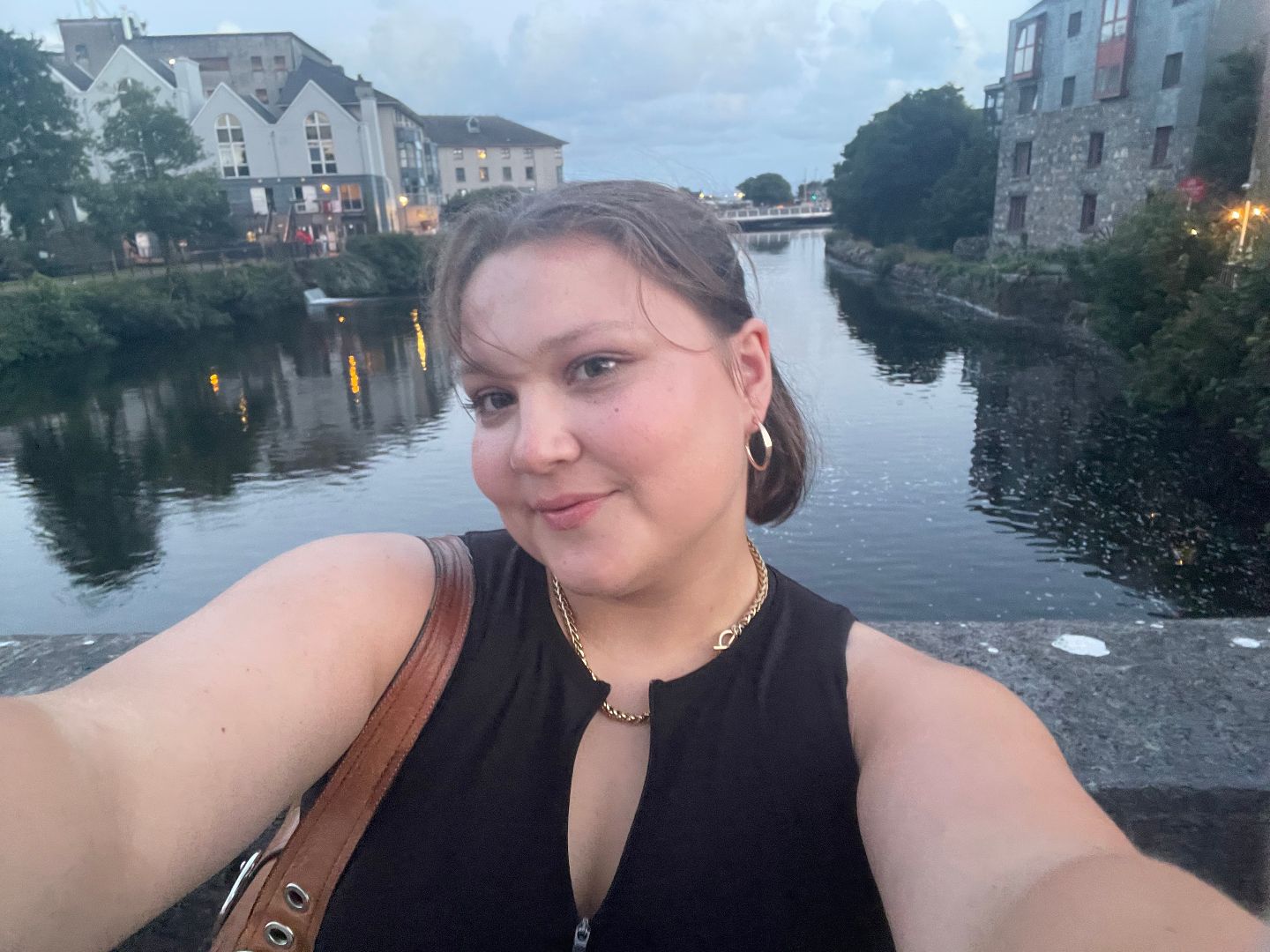 Sarah taking a selfie near a river in Ireland
