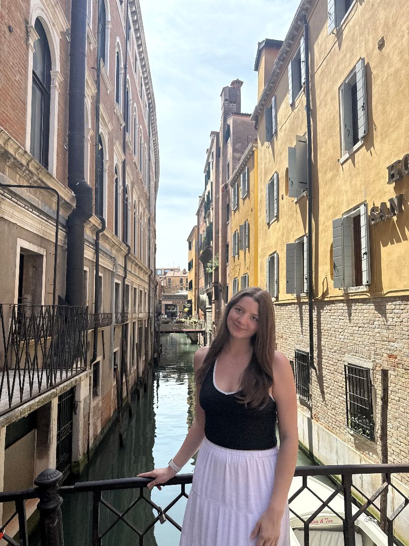 Savannah standing on a bridge in Italy