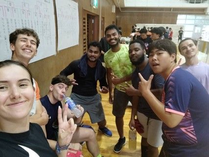 Alex with friends in a classroom in Japan