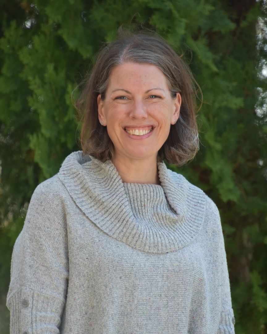 Bethany Wilinski stands outdoors smiling at camera