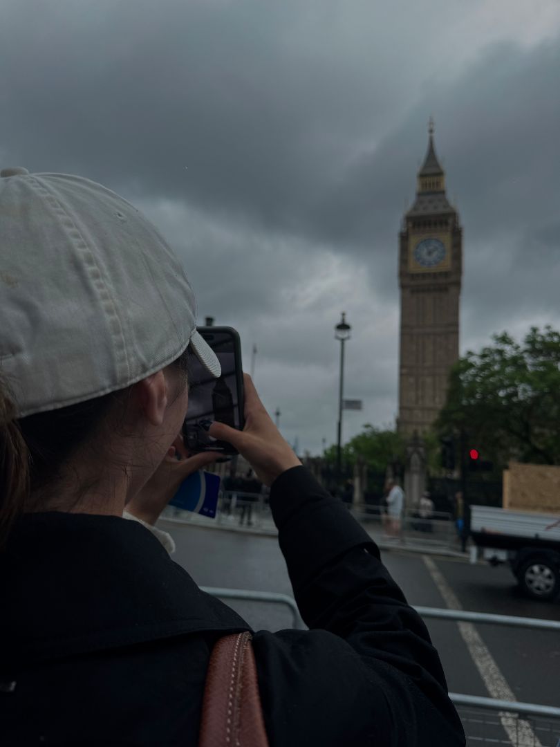 Isabella taking a photo of Big Ben in London