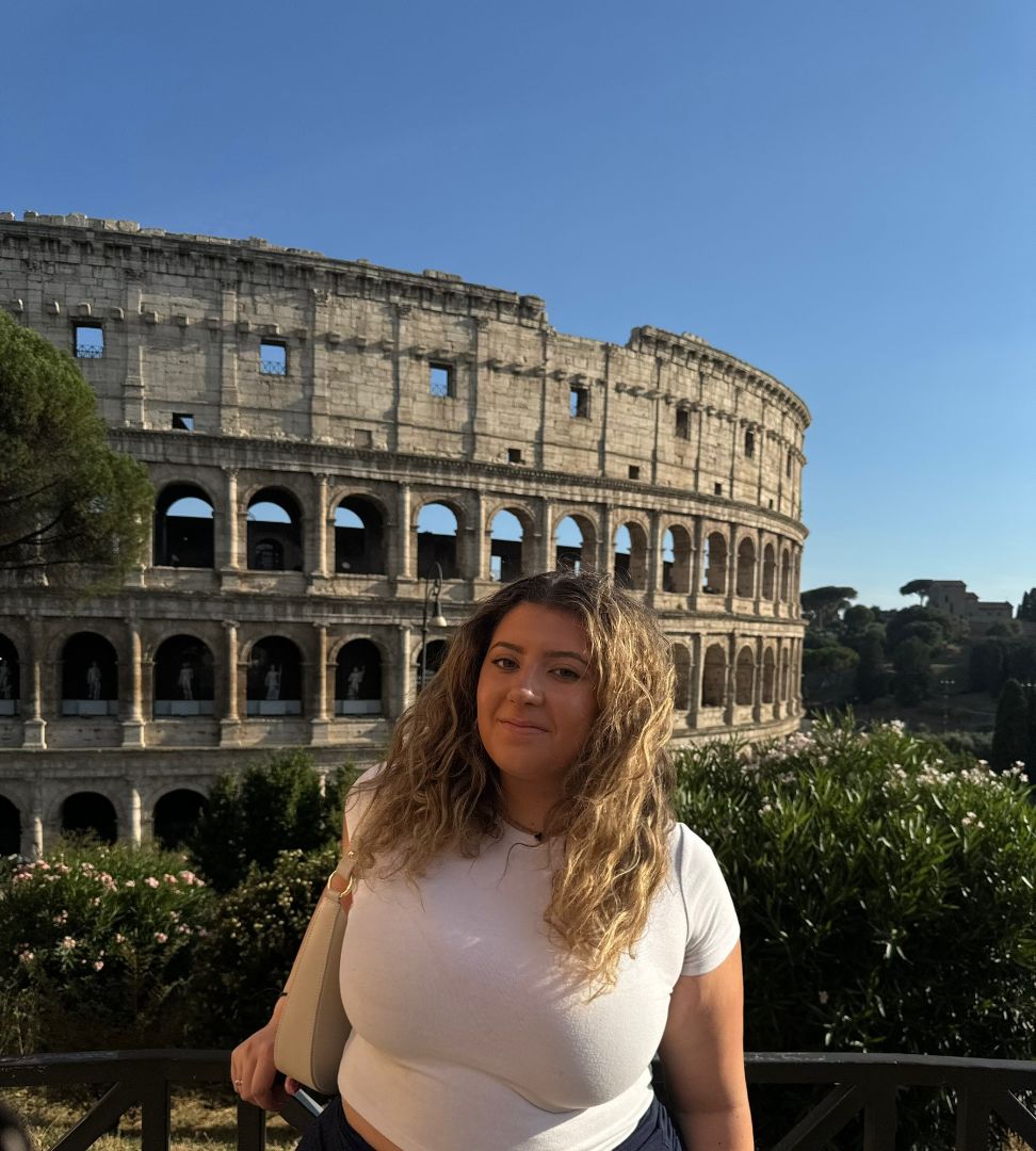 Natalie standing in front of the Roman Colesium