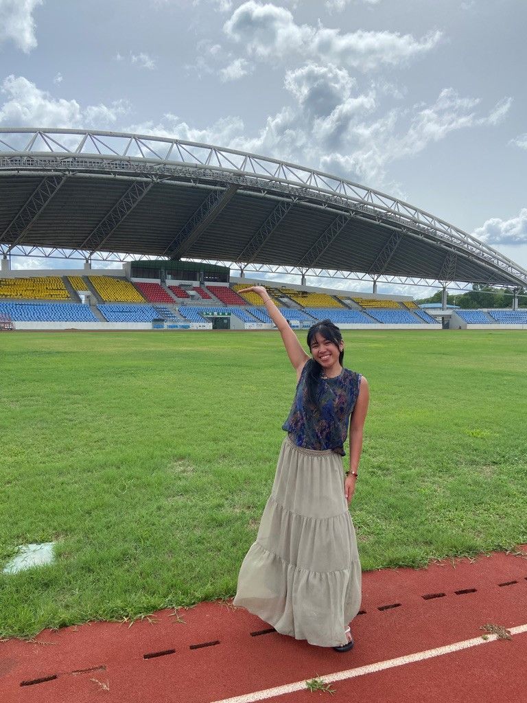 Dea standing with arm up inside a soccer stadium