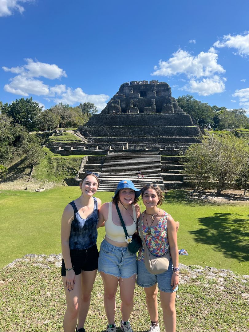 Robin and friends posing in front of Mayan ruins