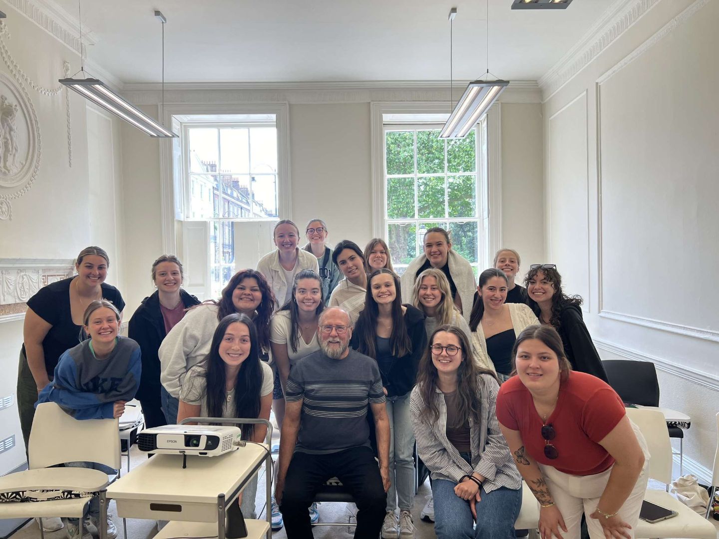 Group shot with Dr. Cooke in a classroom