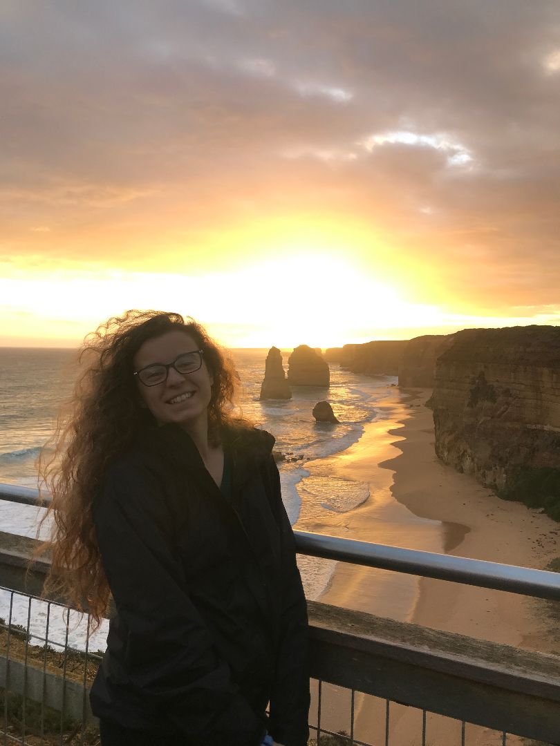 Courtney standing by Great Ocean Road in Australia