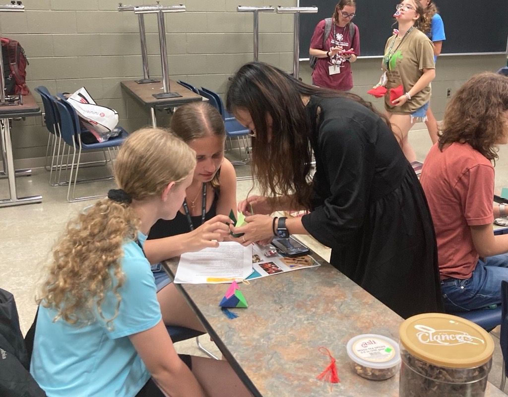 Luna helping students