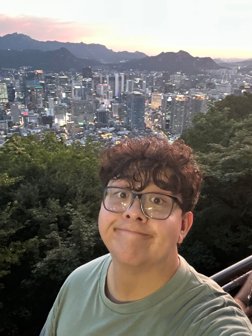 Noah taking a selfie overlooking Seoul